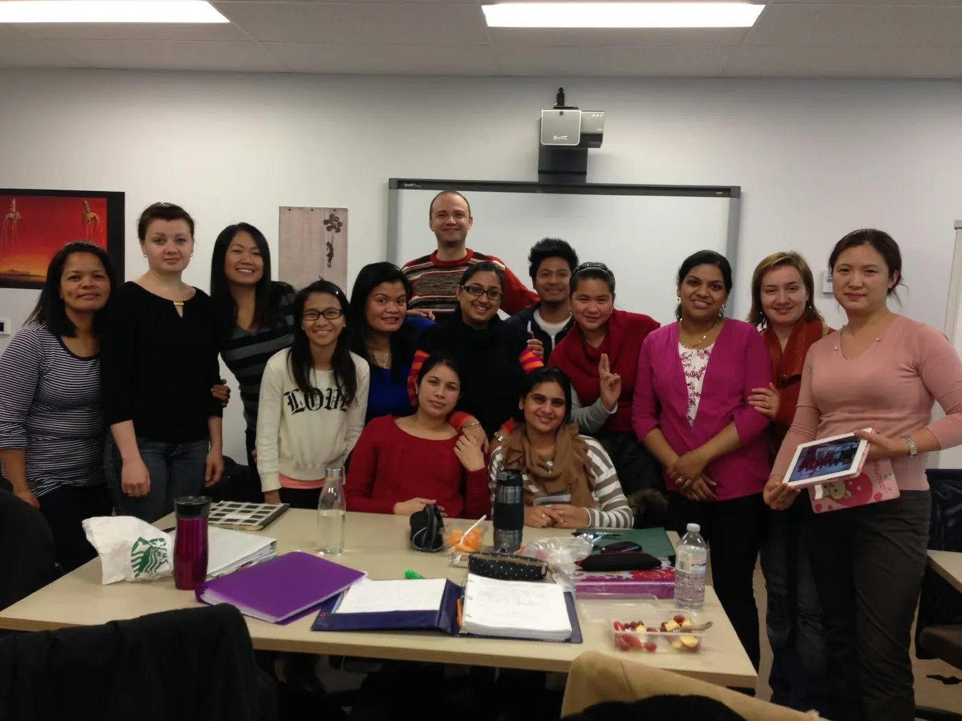 Jasraj with a class of her students around a study table